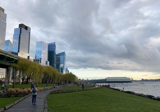 Looking south in Riverside Park, at the skyline on the left and Hudson River on the right, with a dramatic clouded sky